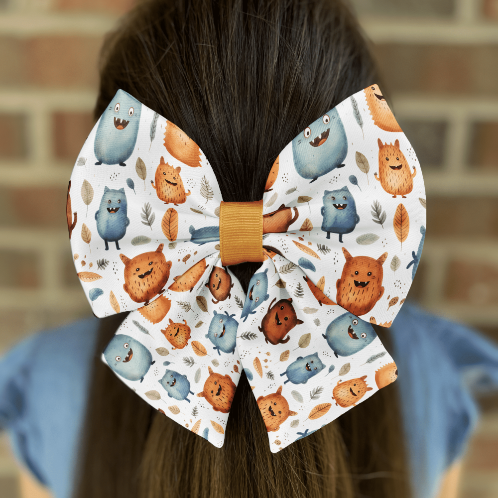 Colorful monster-themed bow on brown hair