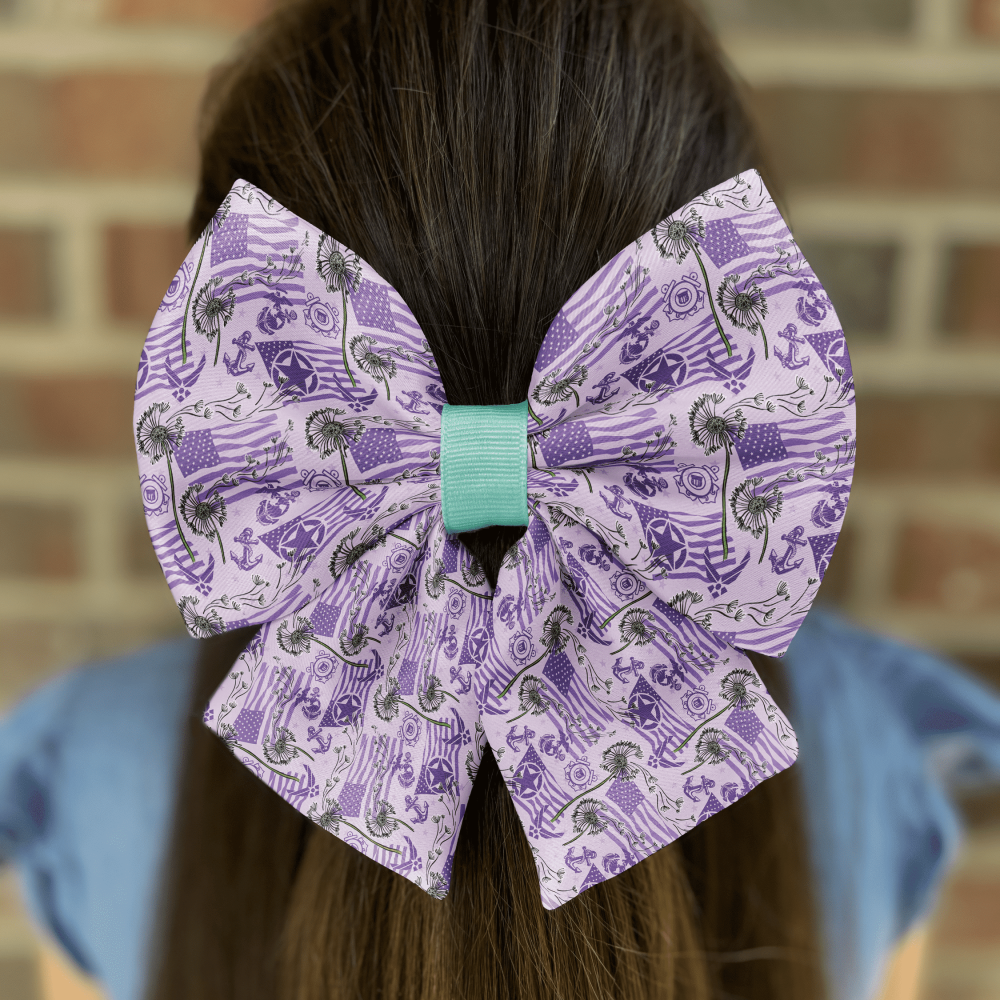 Decorative purple bow on girl's brown hair