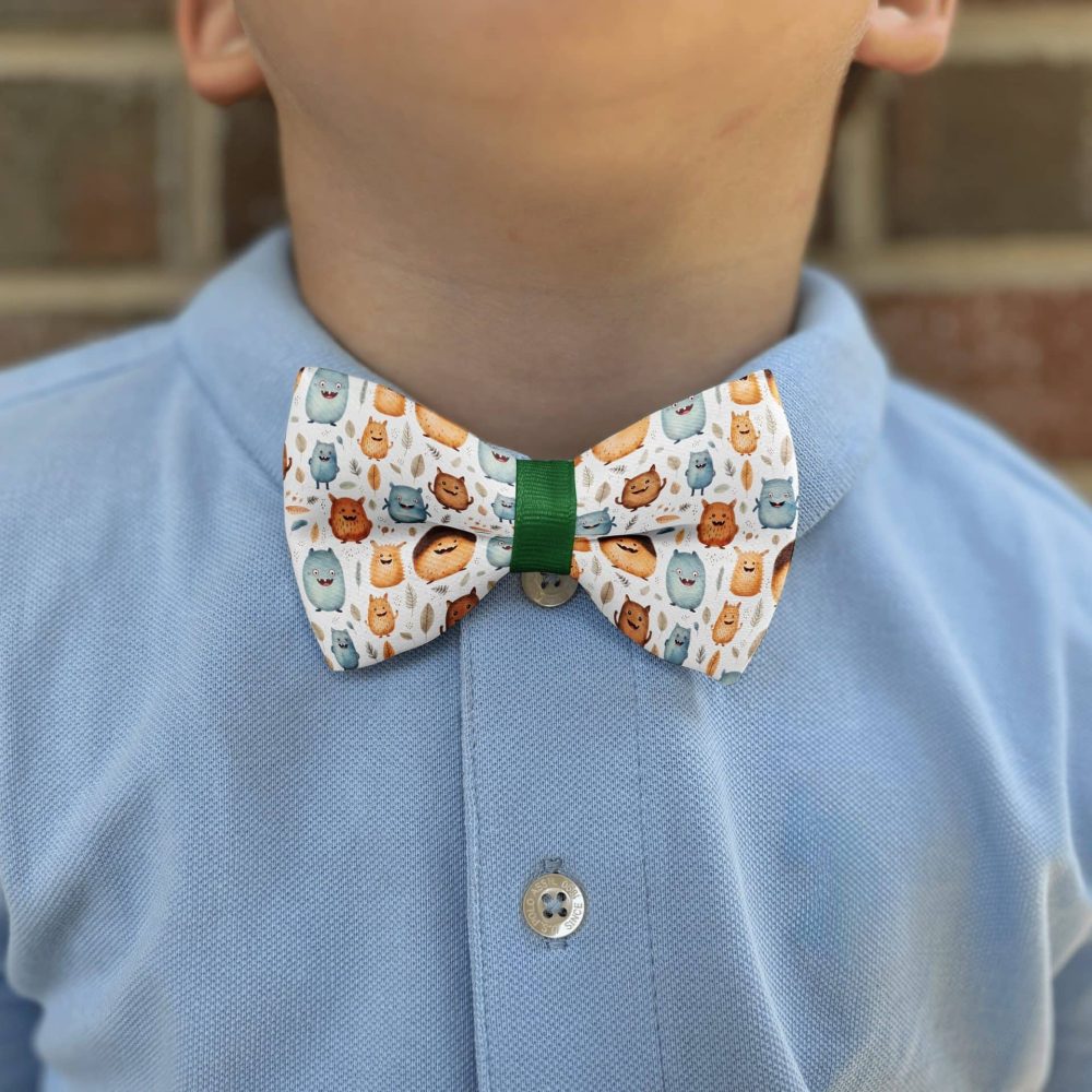 Kid wearing cartoon animal bow tie.