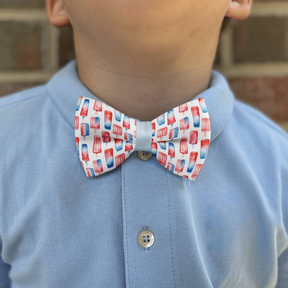 Child wearing popsicle-patterned bow tie.