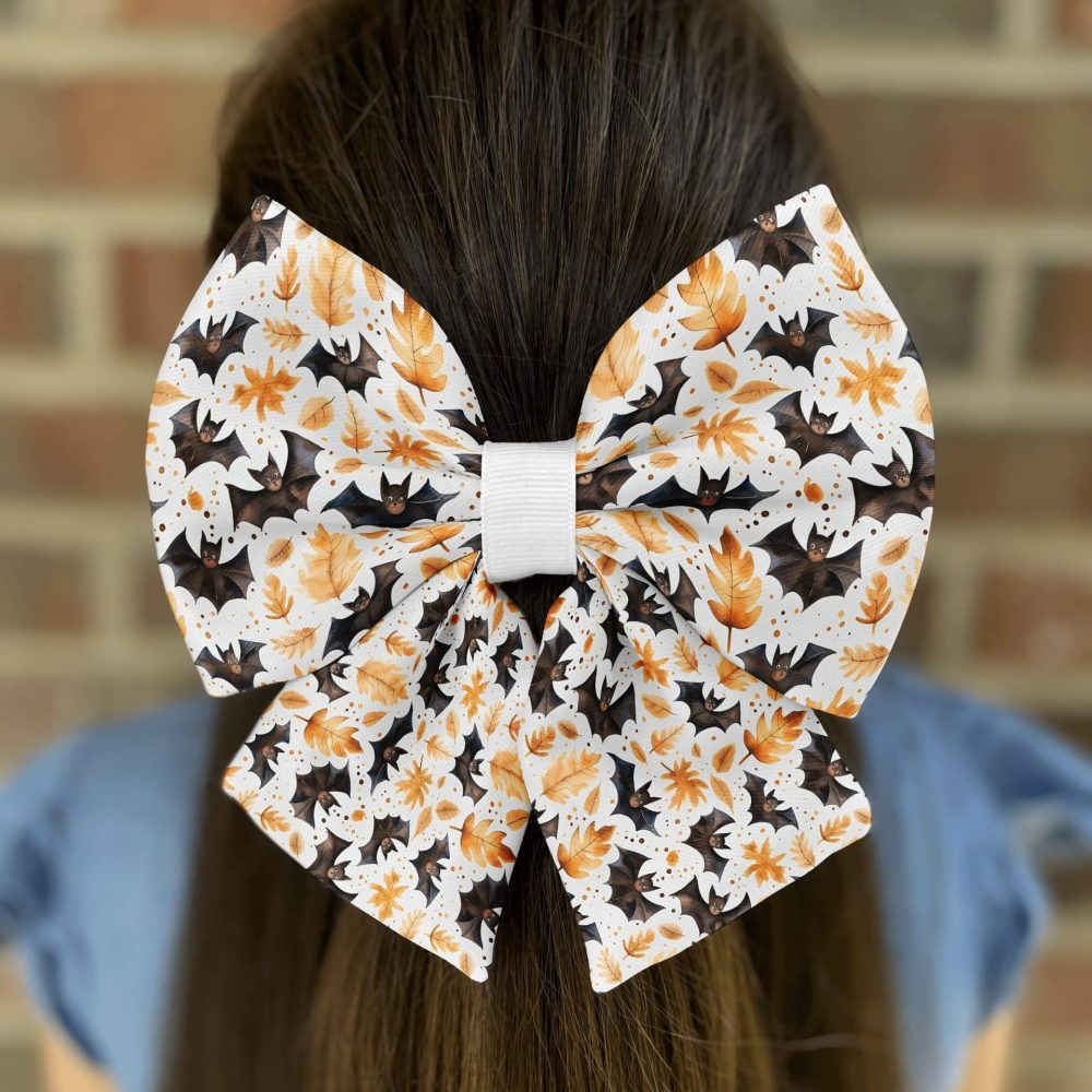 Decorative bat hair bow on brown hair