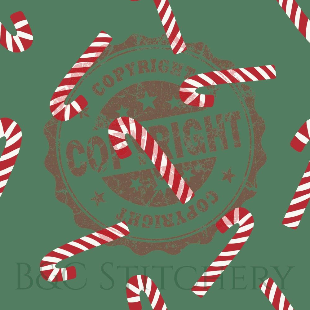 Red and white candy canes on green background.