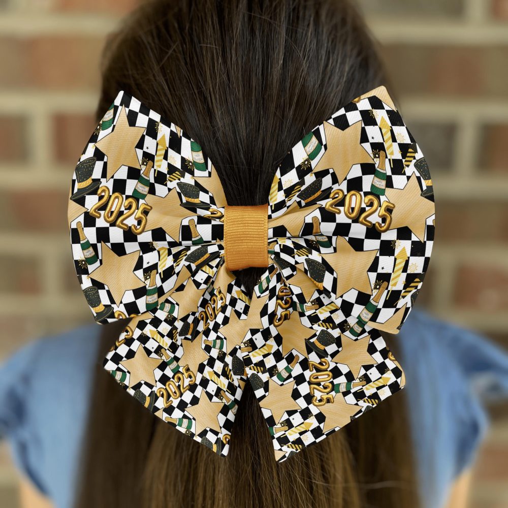 Girl wearing 2025 themed bow on hair.